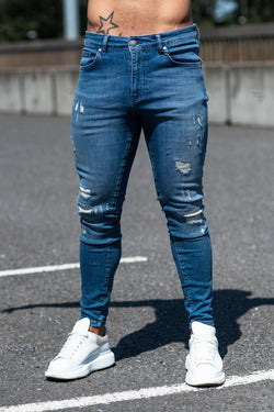 Avora London Rae Skinny Rip & Repaired Jeans in Mid Wash Blue